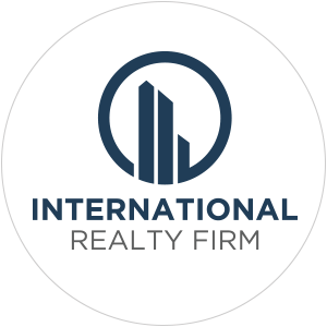 Logo of International Realty Firm featuring stylized buildings and text.